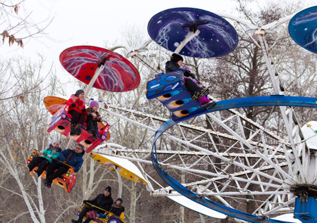 LIPETSK, RUSSIA - February 18, 2018: People at an attraction Maslenitsa Russian pagan holidayのeditorial素材