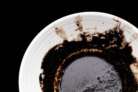 A cup of coffee on a black backgroundの写真素材