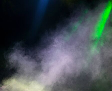 Multi-colored smoke at the concert at nightの写真素材