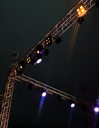 Color searchlight at a concert at night .の写真素材