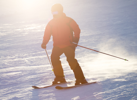 A man skiing in a ski resort .