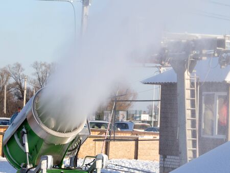 Snow cannon in a ski resort in winter .