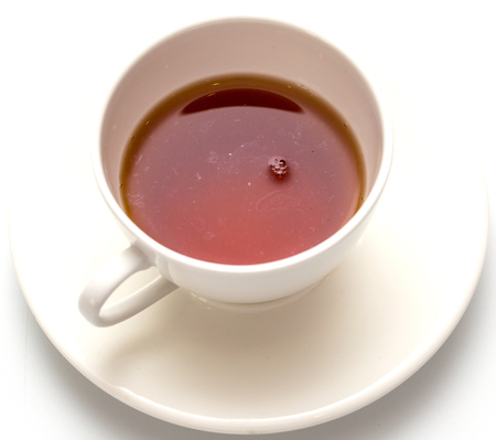 Tea in a cup on a white background .の写真素材