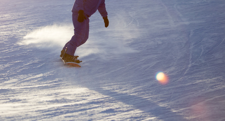 A man on a snowboard in a ski resort .の写真素材
