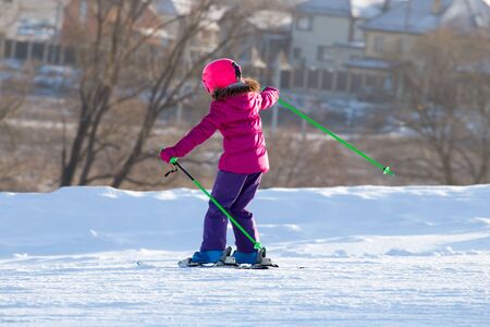 Girl skiing in a ski resort in winter .の写真素材