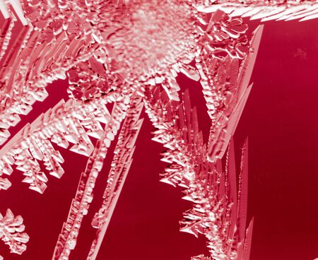 Red drawings on the glass in the frost .の写真素材
