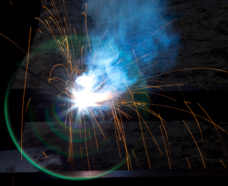 Flash and sparks from electric welding