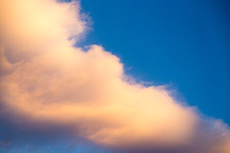 Beautiful clouds in the sky at sunset .