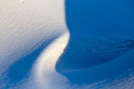 Snow at sunset as an abstract background .の写真素材
