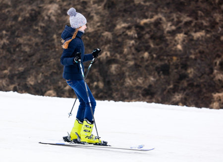 LIPETSK, RUSSIA - MARCH 31, 2018: A girl skiing from the mountainのeditorial素材