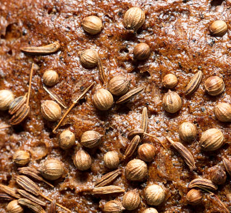 sesame seeds on black bread as a backgroundの写真素材