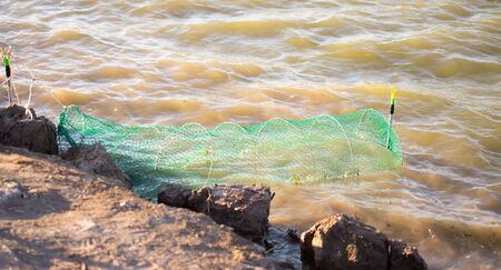 Fish tank on the lake shoreの写真素材
