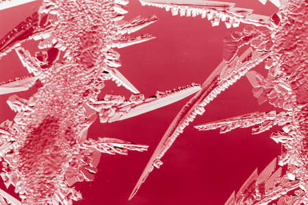 Red drawings on the glass in the frost