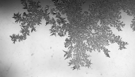 Icy stains on the glass as a background .