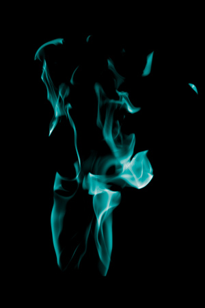 Blue flame of fire on a black background .の写真素材