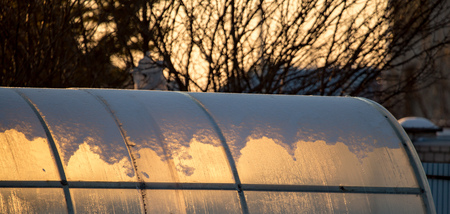 Greenhouse in the rays of sunset in nature .の写真素材