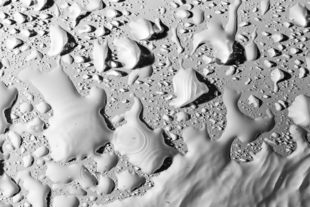 Drops of water with shadow on white background .の写真素材