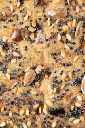 Sesame with seeds and poppy seeds on bread. Macroの写真素材