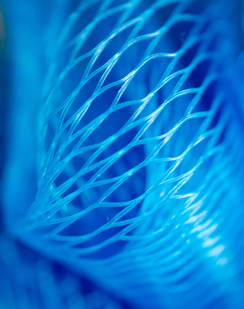 Blue synthetic sponge as an abstract background .