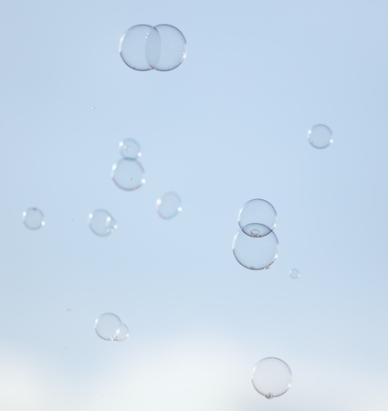 Soap bubbles in flight against the sky .の写真素材