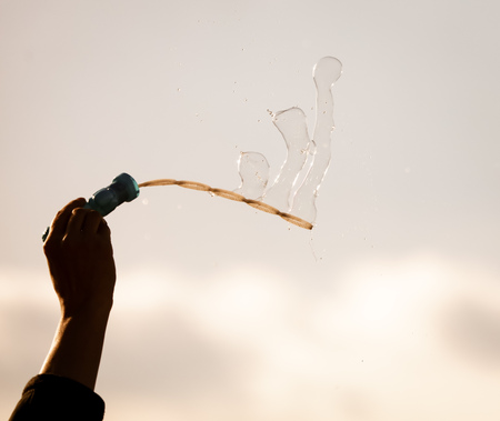Soap bubbles in flight against the sky .の写真素材