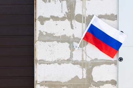 Flag of the Russian Federation at home .