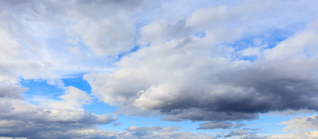 Clouds on a blue sky as a background .