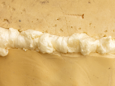 Construction foam in the cracks of the wall at the construction site .の写真素材