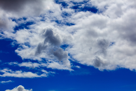 Clouds on a blue sky as a background .