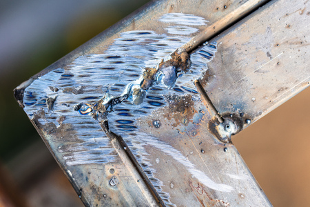 Welding on metal as a background. Macro