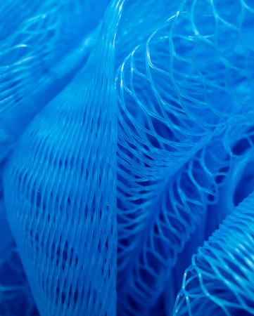 Blue synthetic sponge as an abstract background .の写真素材