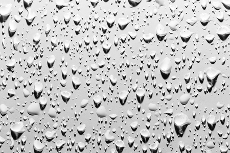 Drops of water with shadow on white background .の写真素材