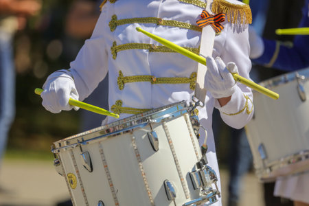 Lipetsk, Russia - May 9, 2018: Girls in military uniforms playing drums in honor of Victory in 1945...