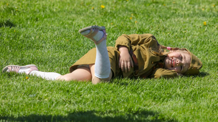 Lipetsk, Russia - May 9, 2018: Girl on the grass at the Victory Day in the 1945 war .のeditorial素材