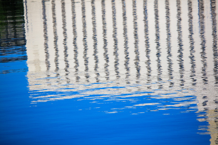 Reflection of a building on the surface of water .の写真素材
