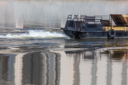 The trail from the ship to the surface of the water .の写真素材
