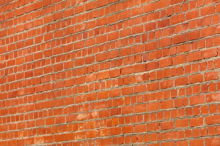 Cobbles of red brick as an abstract background .