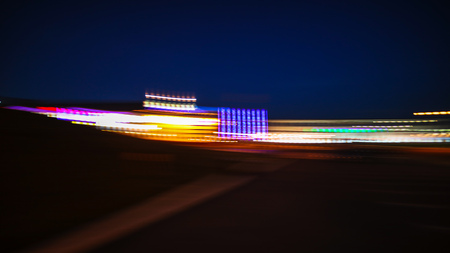 Photo in motion at night as an abstract background .の写真素材