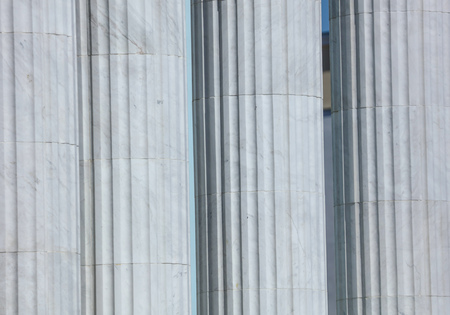 White architectural pillars on the building as a background .