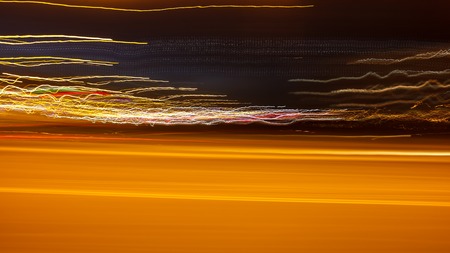 Photo in motion at night as an abstract background .の写真素材