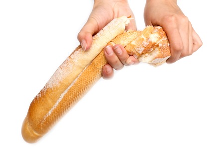 Bread in hand on a white background .の写真素材