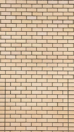 Yellow bricks in the wall as an abstract background .の写真素材
