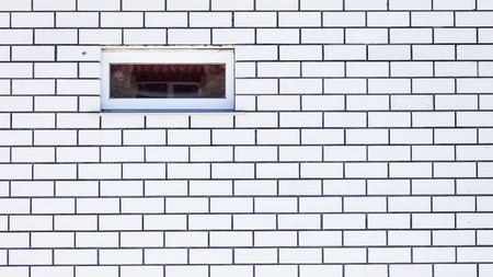 Window in the wall made of bricks .の写真素材