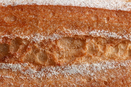 Ruddy crust on bread as an abstract background .