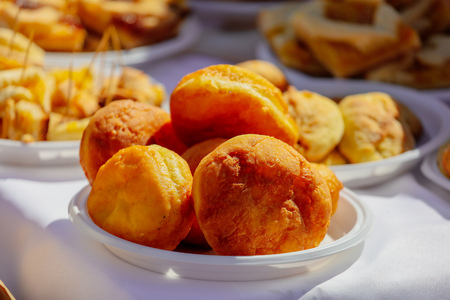 Pies baked from dough on a table .