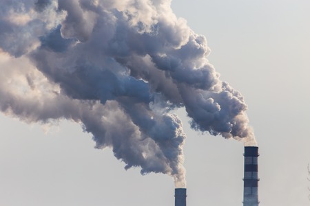 Smoke from the pipes of the factory .