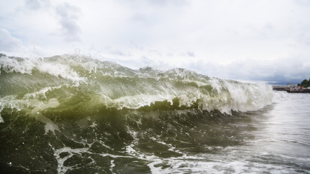 Storm waves on the seashore as a background .