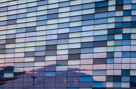 Glass building walls in the rays of sunset as background .の写真素材