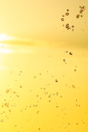 Splashing water at sunset as an abstract background .の写真素材