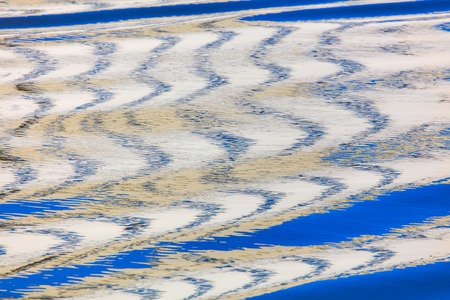 Reflection of a building on the surface of water .の写真素材